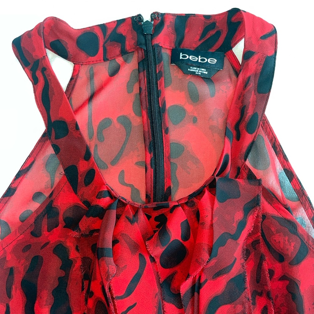 Bebe
Translucent Sleeveless Floral red and black top.
